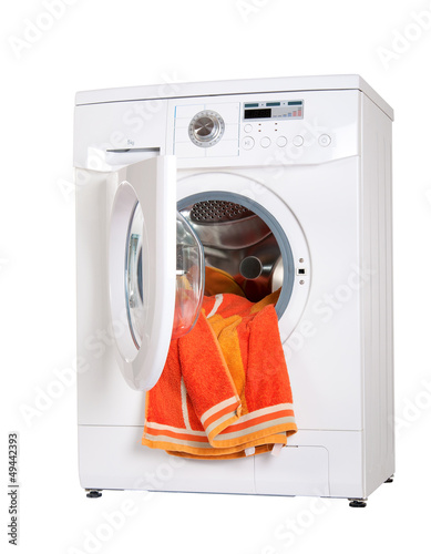 Photo: washing machine with a bright, colored wash laundry. washing machine with a bright, colored wash laundry.