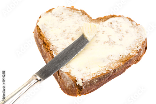 Photo: Butterbrot in Herzform mit Messer Butterbrot in Herzform mit Messer