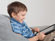Boy playing on tablet
