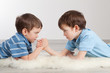 Photo: Arm wrestling and two brothers, Arm wrestling and two brothers,