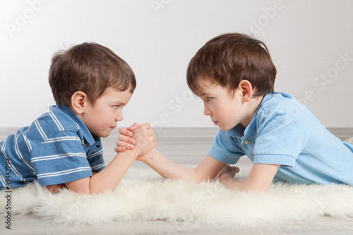 Photo: Arm wrestling and two brothers, Arm wrestling and two brothers,