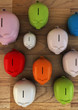 Colorful Plastic Pig Money Boxes on wooden floor - Saving Money