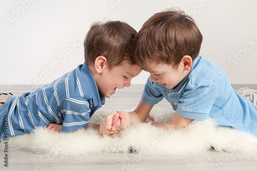 Photo: Arm wrestling and two brothers Arm wrestling and two brothers
