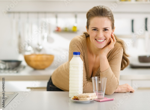 Photo: Portrait of smiling young woman with snacks Portrait of smiling young woman with snacks
