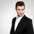 Fashion young businessman in black suit
