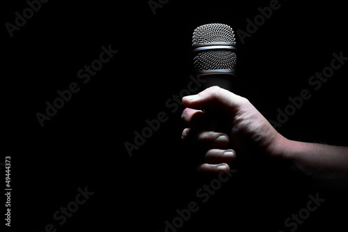 Photo: Hand and microphone Hand and microphone