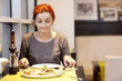 Woman eating a pizza 