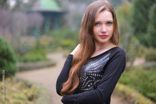 Photo: Young girl posing in the garden Young girl posing in the garden