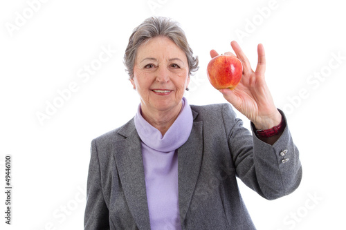Photo: Ältere Frau isoliert mit Apfel in der Hand Ältere Frau isoliert mit Apfel in der Hand