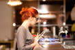 Businesswoman on a coffee break, using tablet computer 