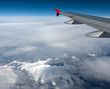 Airplane Flying above the Clouds