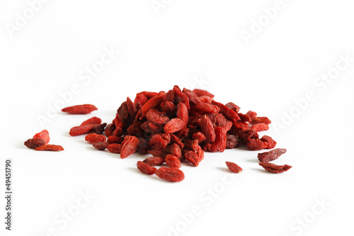 Photo: Goji berries or wolfberry fruit, dried isolated on white Goji berries or wolfberry fruit, dried isolated on white