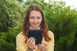 Teen girl reading electronic book