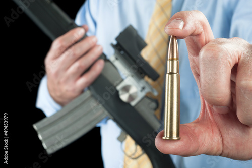 Photo: Man showing bullet Man showing bullet