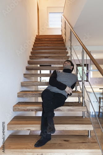 Photo: man sitting on the stairs man sitting on the stairs