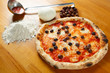 Quadro Italian Pizza, ingredients in the background on a wood table Quadro Italian Pizza, ingredients in the background on a wood table