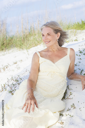 Photo: Attractive Senior Woman Sitting At Beach Attractive Senior Woman Sitting At Beach