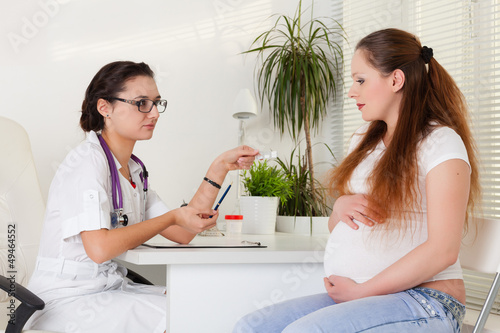 Photo: Pregnant woman and doctor.. Pregnant woman and doctor..