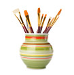 Vase with brushes on a white background