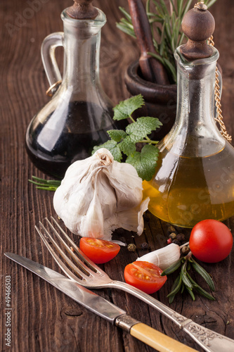 Photo: oil and vinegar, gralic and tomatoes with herbs oil and vinegar, gralic and tomatoes with herbs