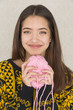 Attractive young woman holding a ball of yarn