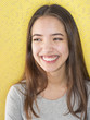 Attractive young woman with natural toothy smile