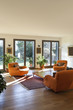 living room with orange armchairs