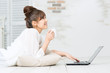 Beautiful asian woman using a laptop computer