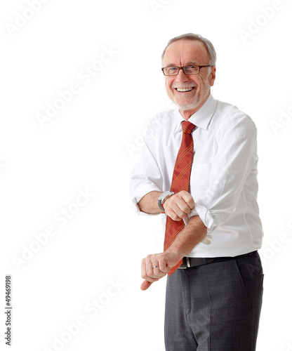 Photo: Isolated mature business man roll up his sleeves Isolated mature business man roll up his sleeves