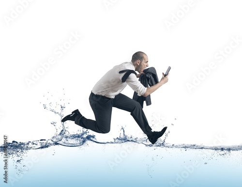 Photo: Businessman run on the water Businessman run on the water