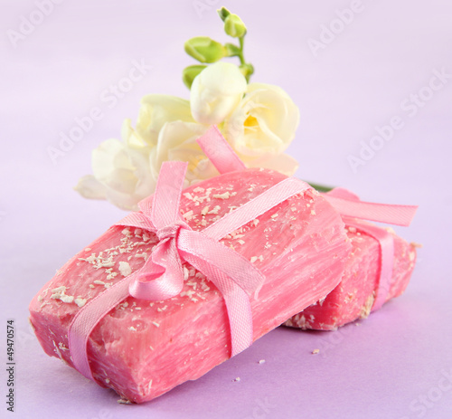 Photo: Natural handmade soap, on purple background Natural handmade soap, on purple background