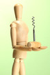 Mannequin with corkscrew, on green background