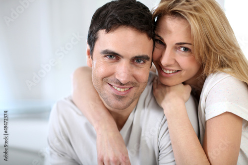 Photo: Cheerful couple embracing each other Cheerful couple embracing each other