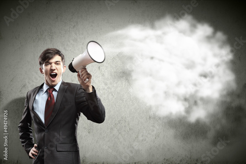Photo: businessman with megaphone businessman with megaphone