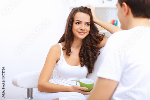 Photo: Young happy couple at hone together s Young happy couple at hone together s