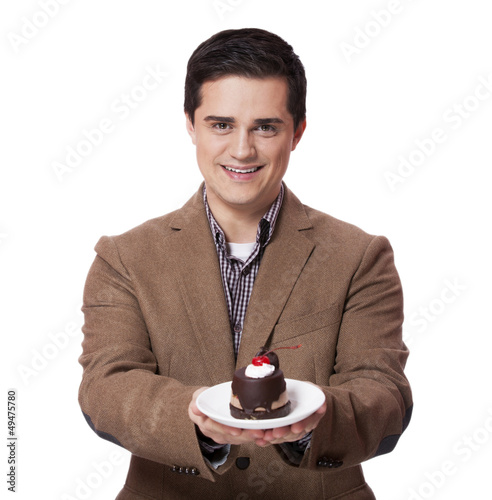 Photo: Man in suit holds cake, isolated on white Man in suit holds cake, isolated on white