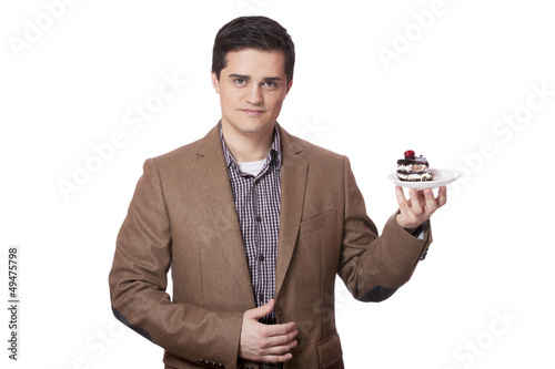 Photo: Man in suit holds cake, isolated on white Man in suit holds cake, isolated on white