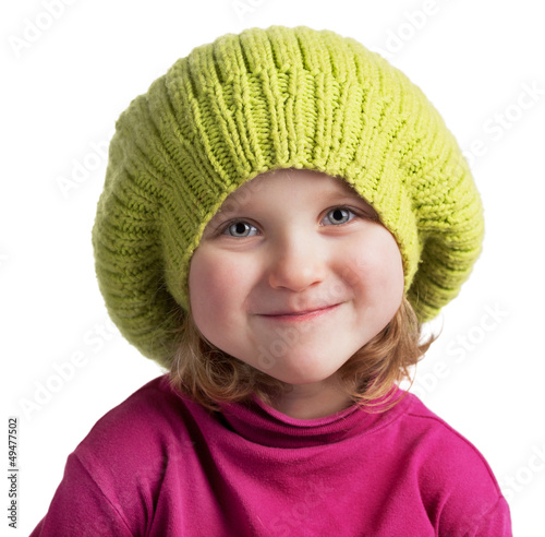 Photo: Happy little girl in a knit cap Happy little girl in a knit cap