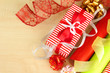 Rolls of Christmas wrapping paper with ribbons, bows