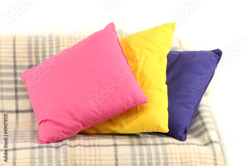 Photo: Colorful pillows on couch isolated on white Colorful pillows on couch isolated on white