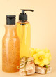 Liquid and hand-made soaps on beige background