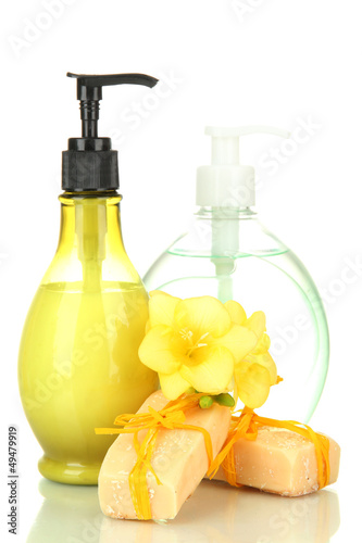 Photo: Liquid and hand-made soaps isolated on white Liquid and hand-made soaps isolated on white