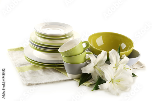 Photo: Empty bowls, plates and cups isolated on white Empty bowls, plates and cups isolated on white