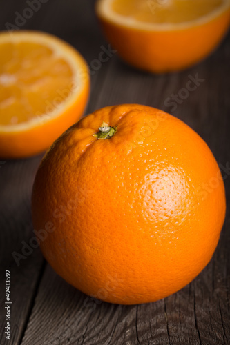 Photo: Close-up of orange fruit on wooden texture Close-up of orange fruit on wooden texture