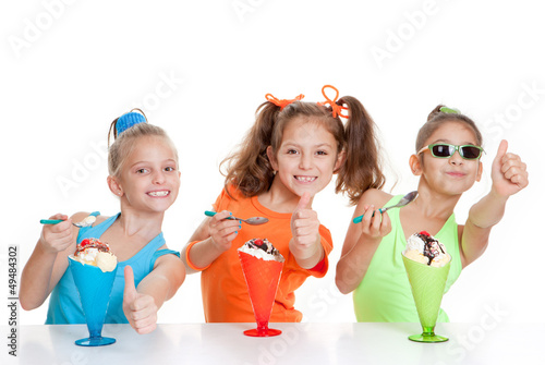 Photo: happy kids with thumbs up to eating happy kids with thumbs up to eating