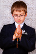 boy going to the first holy communion