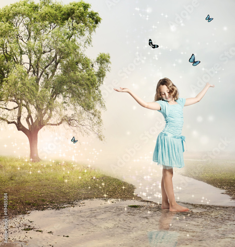 Photo: Girl with Blue Butterflies at a Magical Brook Girl with Blue Butterflies at a Magical Brook