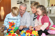 Grandparents and grandchildren playing