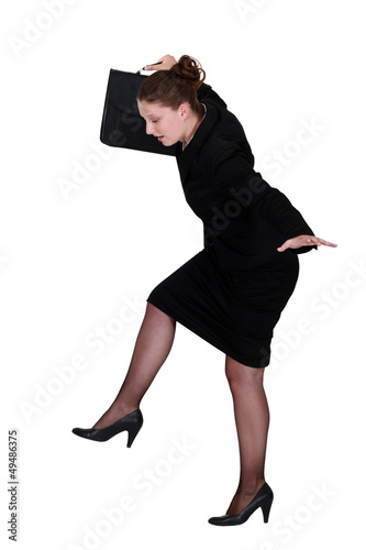 Photo: businesswoman trying to balance businesswoman trying to balance
