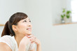Beautiful asian woman relaxing in bedroom